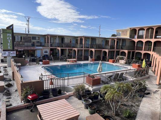 Balcony view of my room.  BTW this was taken during Daytona Bike week. Pool was clean & used daily by the patrons during our stay.