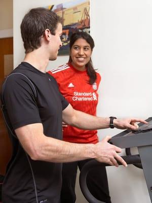 Setting up my client on the treadmill @ my private studio in Allston, Ma. Ever try interval training?? Great for fat loss!