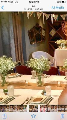 We had a very long rectangular table. Flowers were in the center of the table. Looked beautiful.