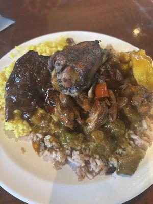 Curried goat , pigeon peas and rice , jerk chicken, yellow rice