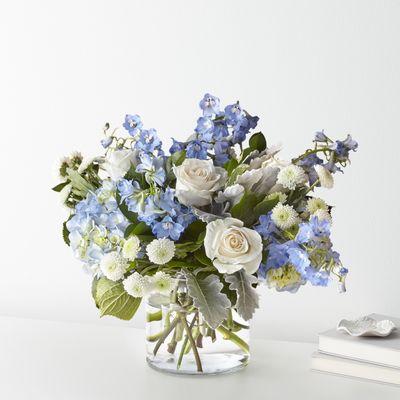 Celebrate any occasion with the Clear Skies Bouquet! A fresh hydrangea arrangement with blue delphinium & roses...