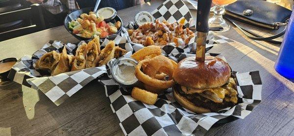 Southwest eggrols, buffalo chicken fries, side salad and smash burger with onion rings.