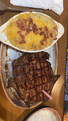 20 oz Ribeye Cooked Medium Rare and twice baked potato.