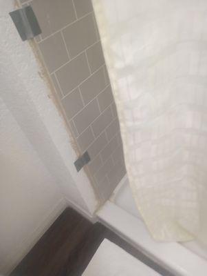 Shower filthy and worn.