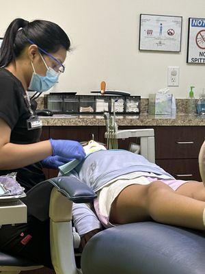 Daughter getting her routine dental check.