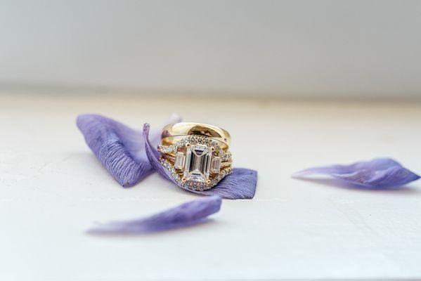 My engagement ring with a jacket around it. With my husband's band on top of my set
