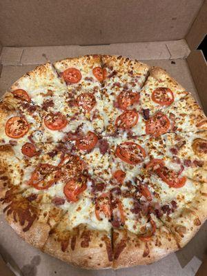 White Cheezy - bacon, onions, sliced tomatoes, garlic parmesan sauce, and feta cheese