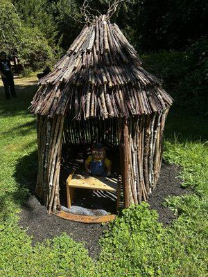 Little pig in wood house