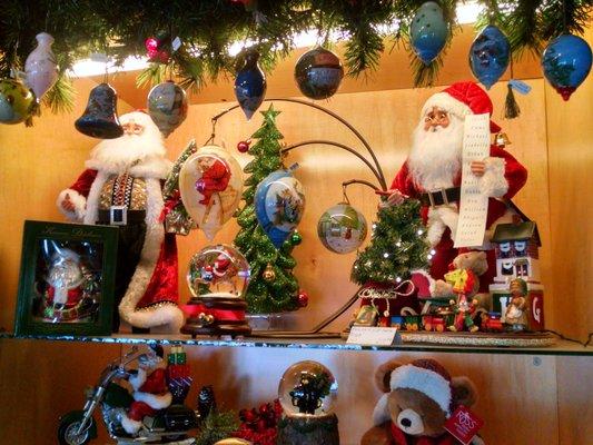 Inside painted glass and collectable Santa figures.