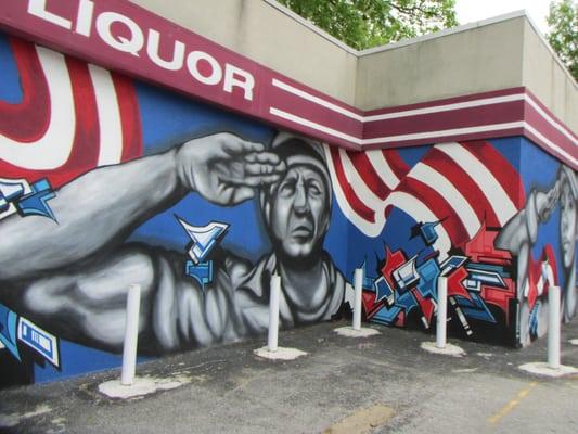 patriotic wall mural on outside wall of store