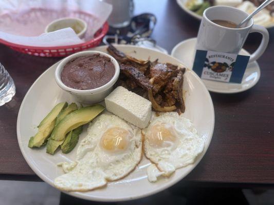 Breakfast: eggs, beans, fresh cheese, avocado, steak, coffee
