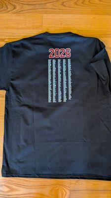 School shirt with names that can't be read.