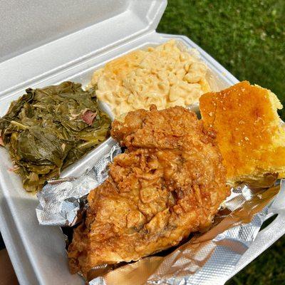 Fried chicken breast meal with collard greens, the cheesiest mac n' cheese and corn bread