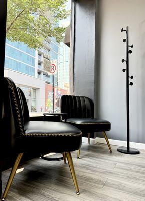 Our luxe Lakeview waiting area blends modern comfort with natural light and city views -- the perfect welcome before your custom spray tan.