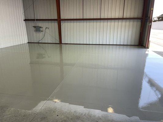 Airplane hanger floor epoxy looks gorgeous.