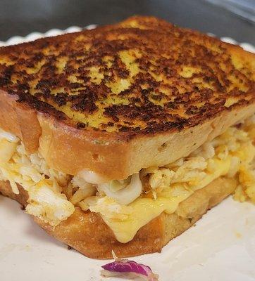 It's a must cafe CRABMELT made with REAL CRAB! Dressed with homemade Balsamic coleslaw, served on butter garlic toast!