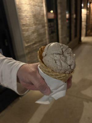 One scoop of cookies and cream with a waffle cone