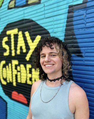 Color blocking and shaggy curl cut by Maddye in East Austin hair salon.