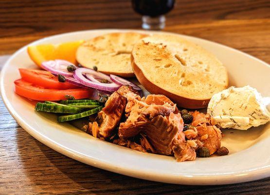 NW Salmon Plate - Hot smoked salmon, toasted bagel, dill cream cheese, tomatoes, cucumbers, red onion, and capers