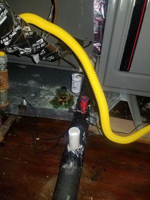 Water flowing out of drain pipe vs going into backup drain pan.