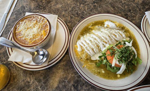 Cheese enchilada and refried beans. Everything presented beautifully.