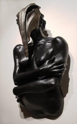 "The Guardian" A wall sculpture made of terracotta.