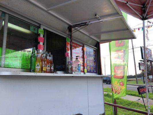 Food truck on side of the road. In a used car lot. Its everything you want it to be.