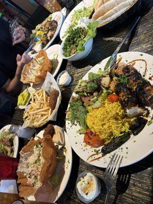 Chicken kabob and plenty of side dishes