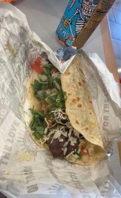 Steak taco with beef , cilantro lime rice , pico de gallo , mild green salsa , cheese