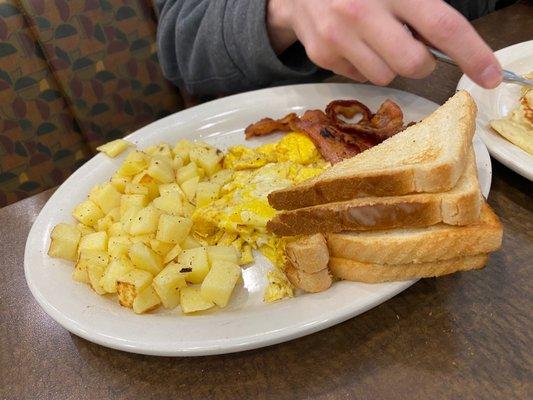 Undercooked potatoes not properly scrambled eggs