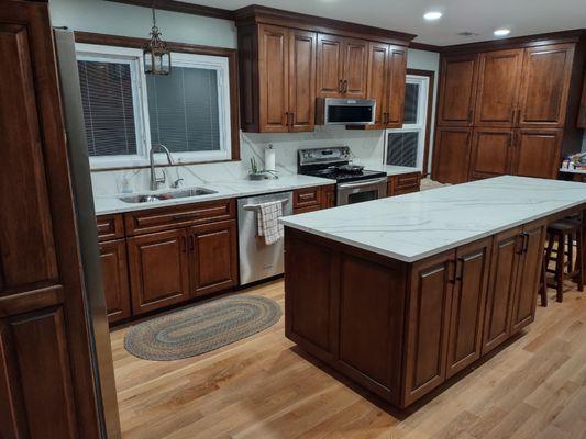 Cabinets on one side of the island.
