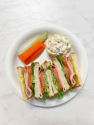 The Deluxe Club with Turkey, Ham, and Bacon on 3 layers of bread!