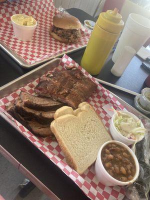 Ribs brisket and a pulled pork sandwich