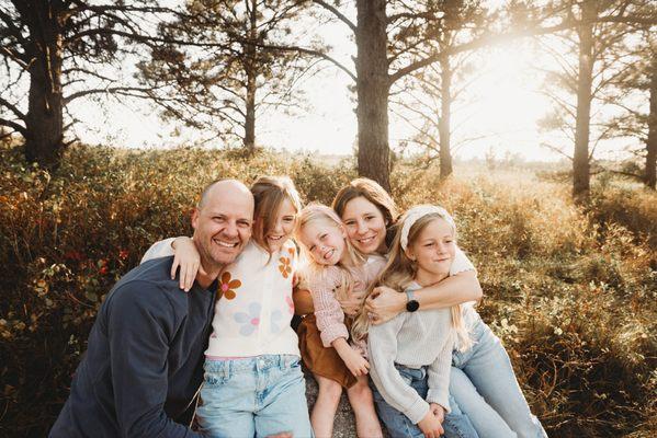 A family snuggles up during a limited edition fall mini near Sweet Briar Lake, ND.