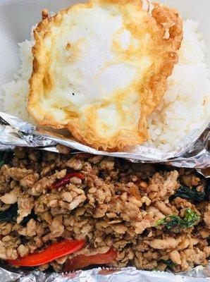 Togo order! Pad GraPow ground chicken over rice (stir-fried garlic chili basil)..Fried egg on top.very yummy