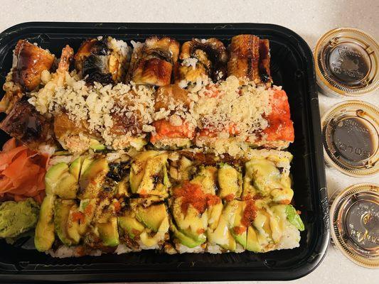 Top is scorpion (shrimp tempura topped with eel), middle is called spicy family, bottom was called wasabi cake, topped with tobico