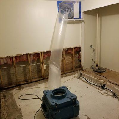 Negative exhaust for basement mold remediation