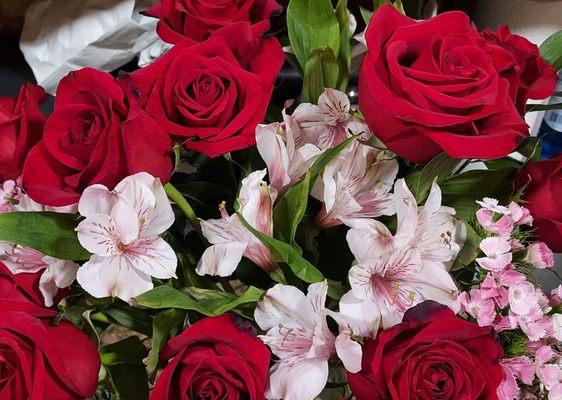 Peruvean Lilies and red roses.