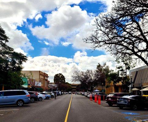 Claremont village down Yale street with cool clouds.