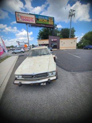 Junk car that was sitting inside a garage for 10 years after seller sold house it needed to be removed and towed to the junkyard.