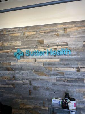 Sutter health logo above the front desk