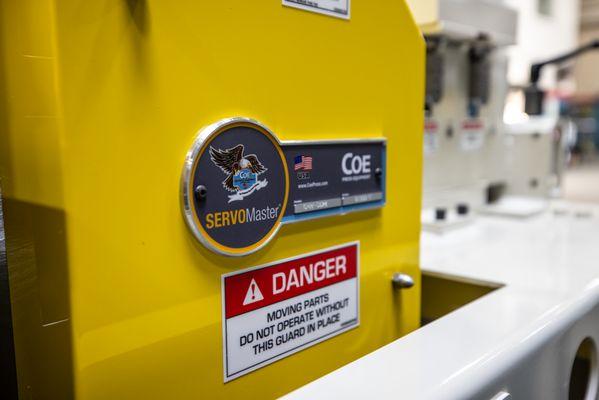 Close up of a COE Press Equipment ServoMaster Feed.