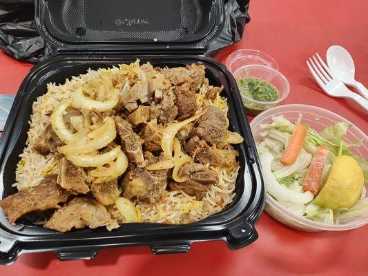 The color is off but it was beautiful in person. The rice is so delicious! Goat meat had bones. It was a very delicious, reasonable meal.