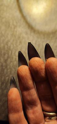 Glue and acrylic stuck under nail. Horrible shape. Gem attached to literal tip of nail