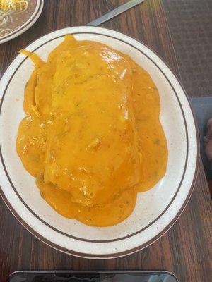 Wet loaded burrito with queso