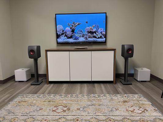KEF LS50 Wireless II active speakers with REL Acoustics subwoofers and Salamander Designs cabinet