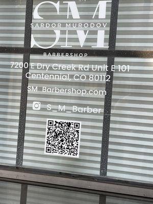 Sign on front door with address and QR code