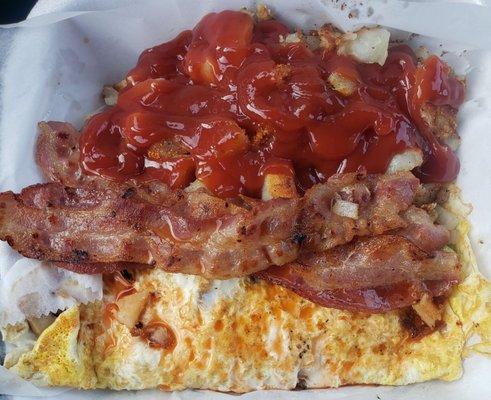 Veggie omelet home fries and bacon
