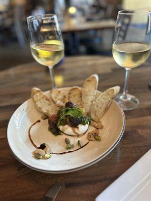 Burrata with pesto, roasted tomatoes and pistachios.