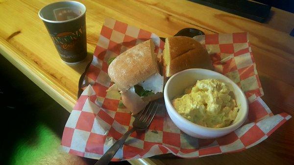 Sandwich with side + triple expresso= $15. Pricey, but a good meal.